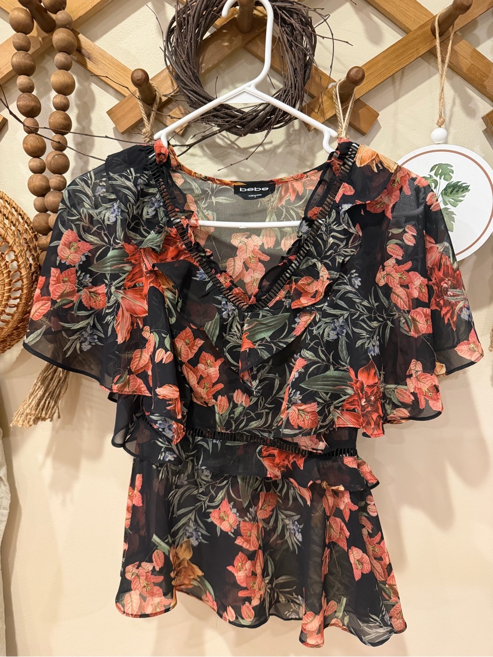 bebe Black Floral Ruffle V-Neck Blouse with Red-Orange Blooms